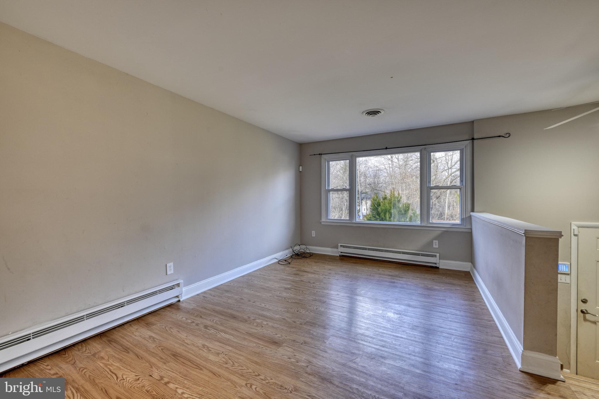 3500 East Lawndale Road Reisterstown, MD 21136 - Photo 5 of 31 a view of room with window and wooden floor