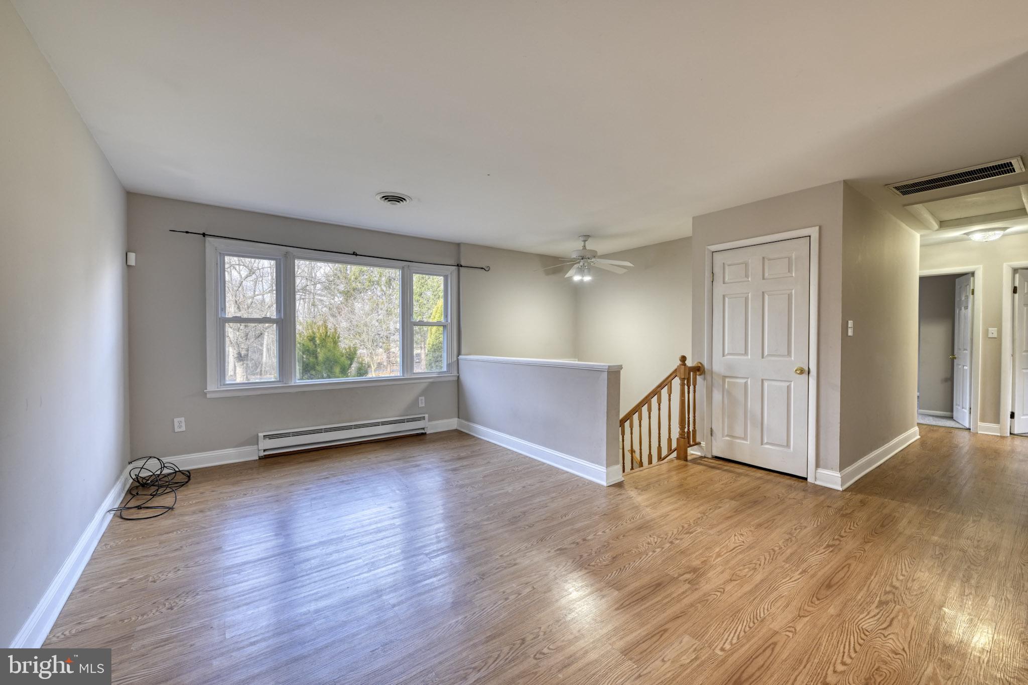3500 East Lawndale Road Reisterstown, MD 21136 - Photo 6 of 31 an empty room with wooden floor and windows