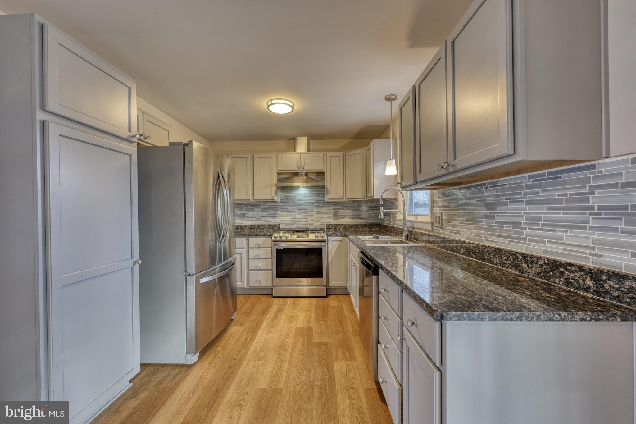 3500 East Lawndale Road Reisterstown, MD 21136 - Photo 10 of 31 a kitchen with cabinets and stainless steel appliances