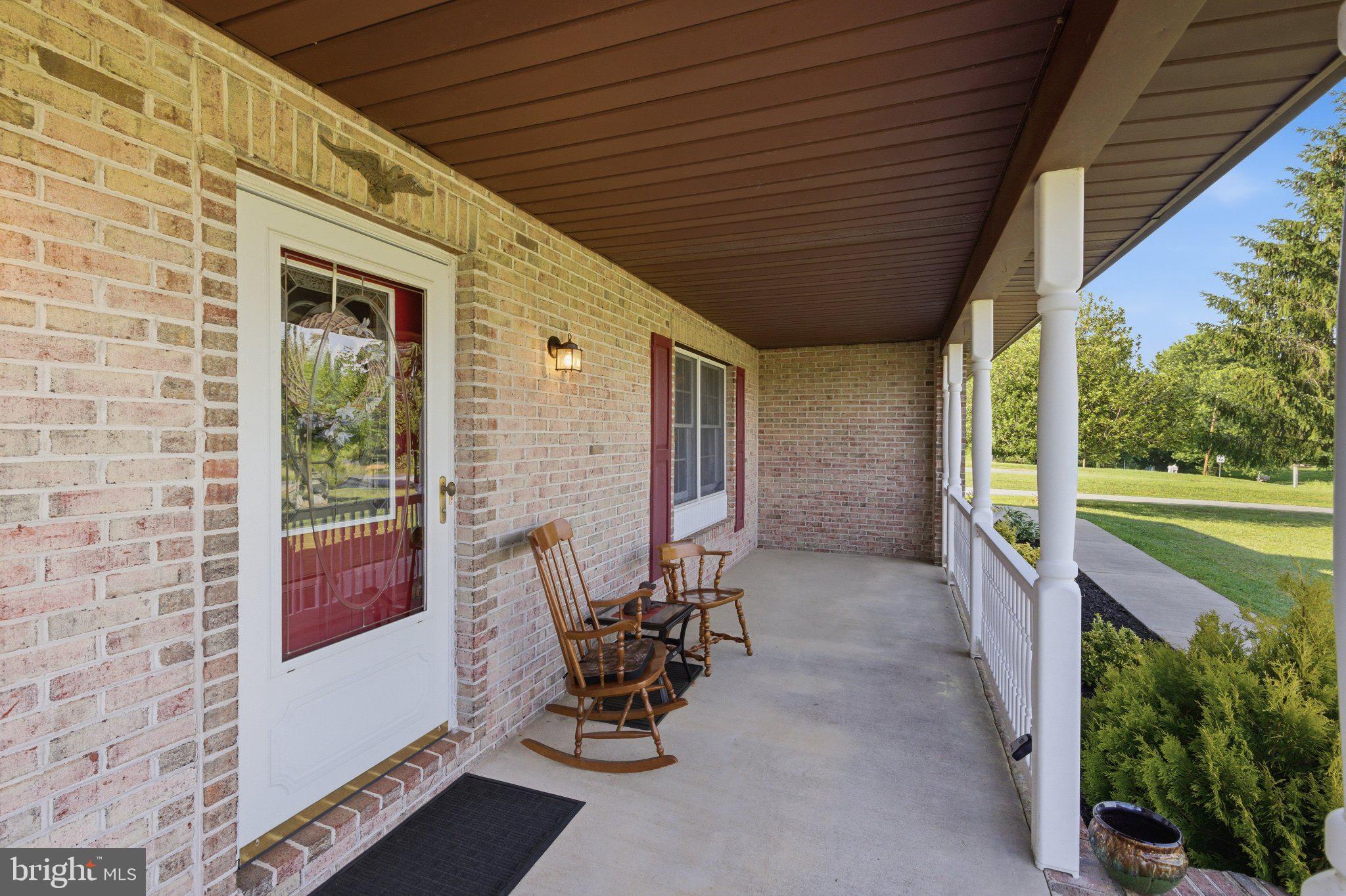 18310 Upper Beckleysville Road Hampstead, MD 21074 - Photo 9 of 67 Charming porch with inviting rockers.