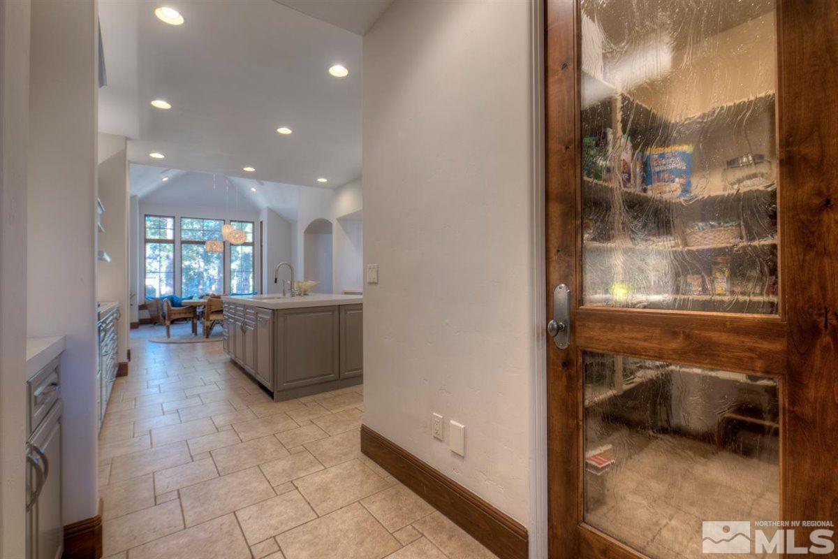 6090 Lake Geneva Drive Reno, NV 89511 - Photo 12 of 40 a view of a hallway and a livingroom with furniture