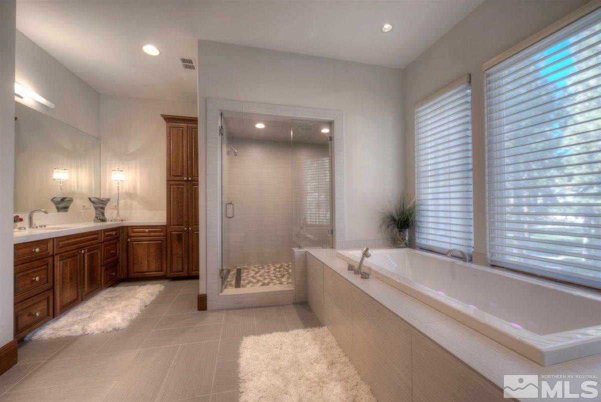 6090 Lake Geneva Drive Reno, NV 89511 - Photo 16 of 40 a large spacious bathroom with a large tub and shower