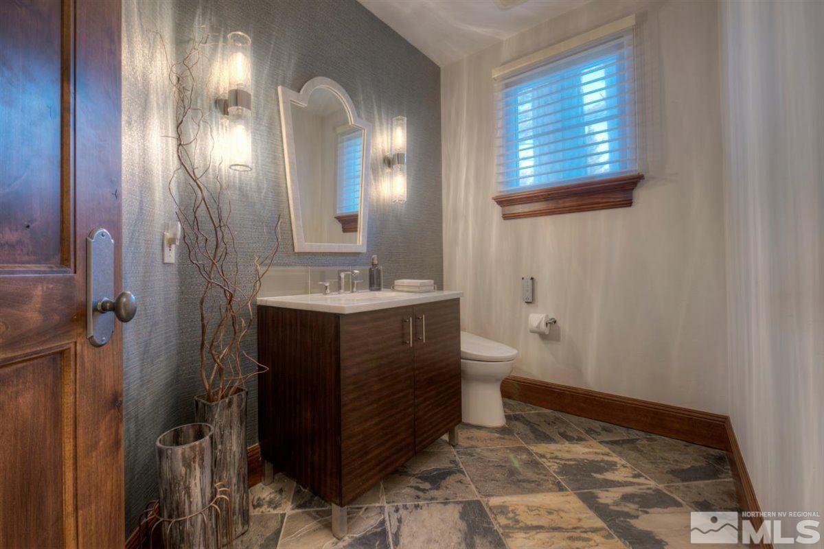 6090 Lake Geneva Drive Reno, NV 89511 - Photo 23 of 40 a bathroom with a sink and a mirror