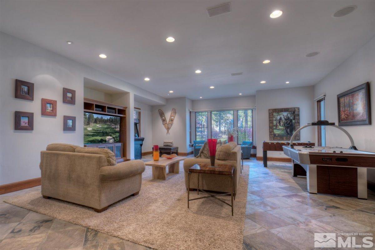 6090 Lake Geneva Drive Reno, NV 89511 - Photo 26 of 40 a living room with fireplace furniture and a flat screen tv