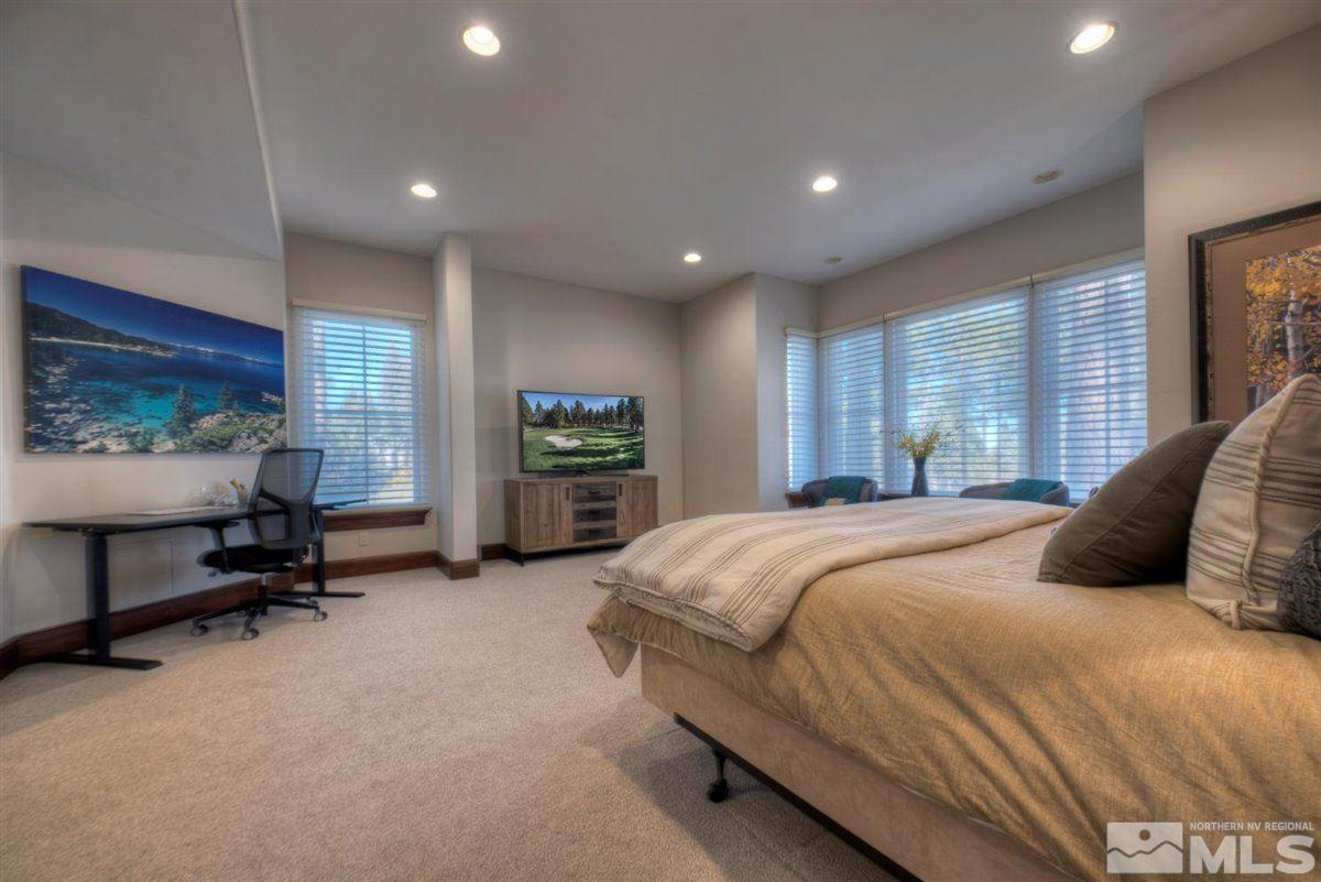 6090 Lake Geneva Drive Reno, NV 89511 - Photo 27 of 40 a bedroom with a bed and a couch