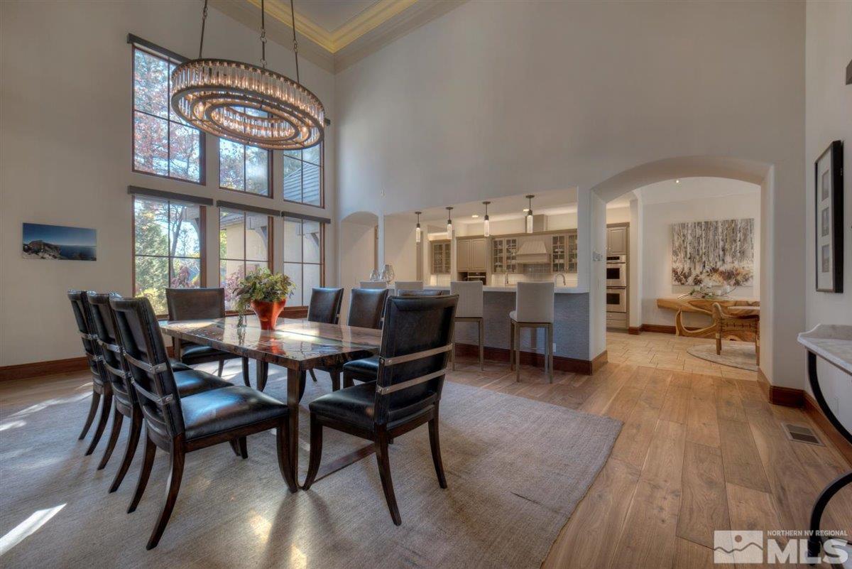 6090 Lake Geneva Drive Reno, NV 89511 - Photo 7 of 40 a view of a dining room with furniture and a chandelier