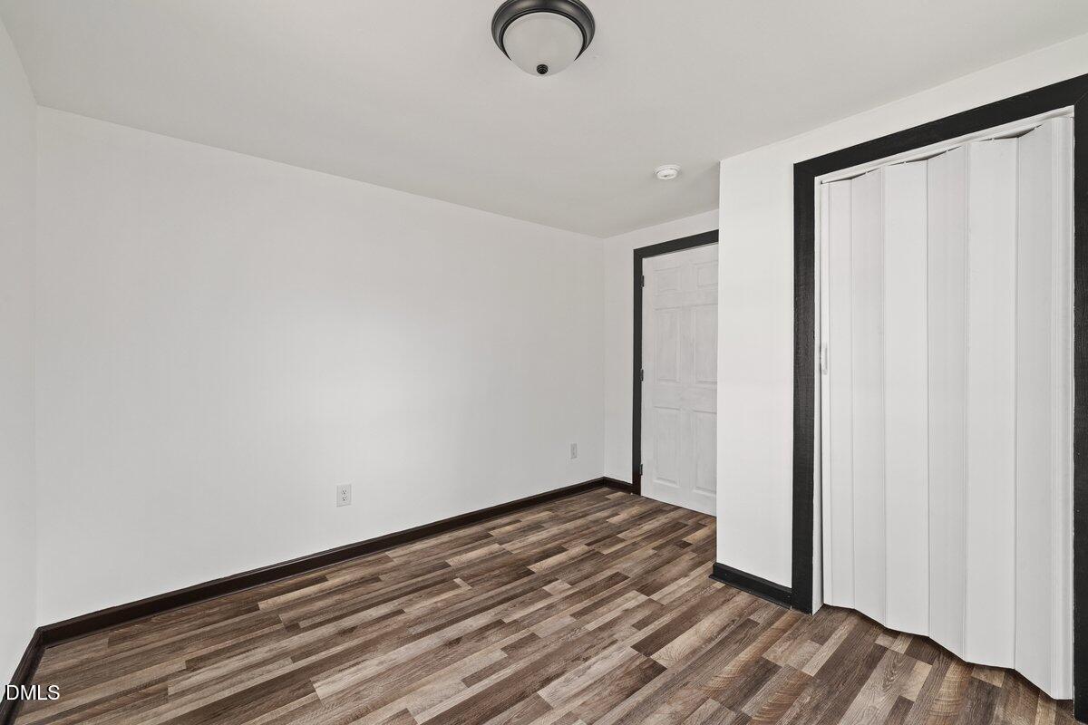 601 Temple Street Selma, NC 27576 - Photo 6 of 13 a view of a room with wooden floor