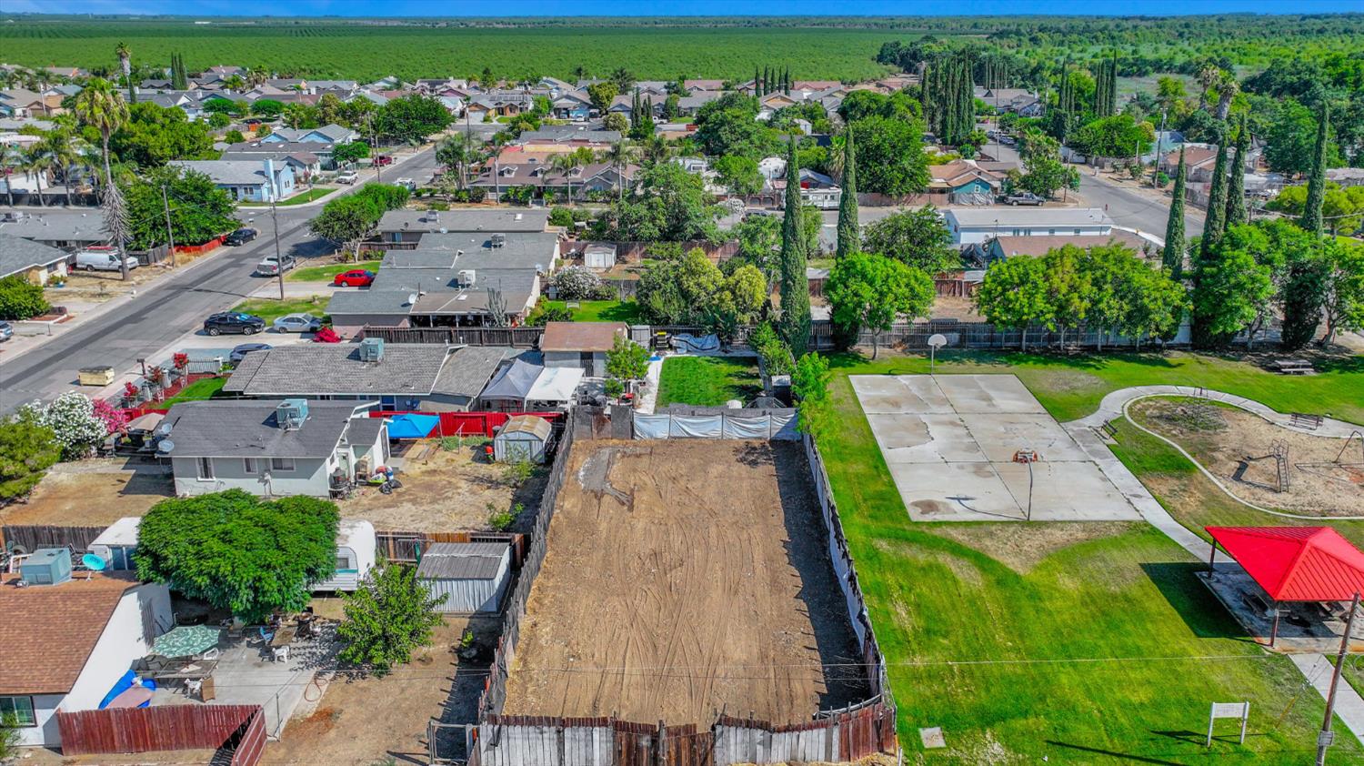 an aerial view of a houses with yard