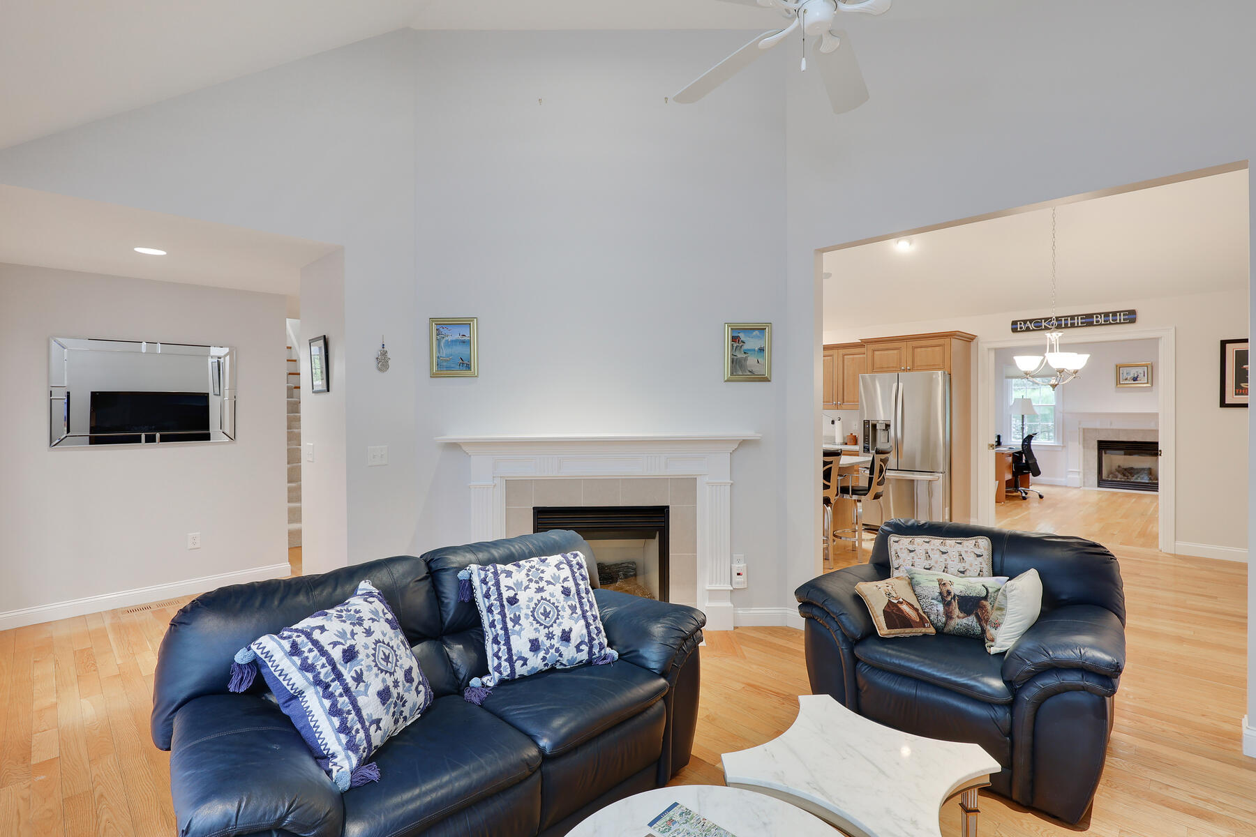 24 Sea Robin Road Osterville, MA 02655 - Photo 4 of 45 a living room with furniture and a fireplace