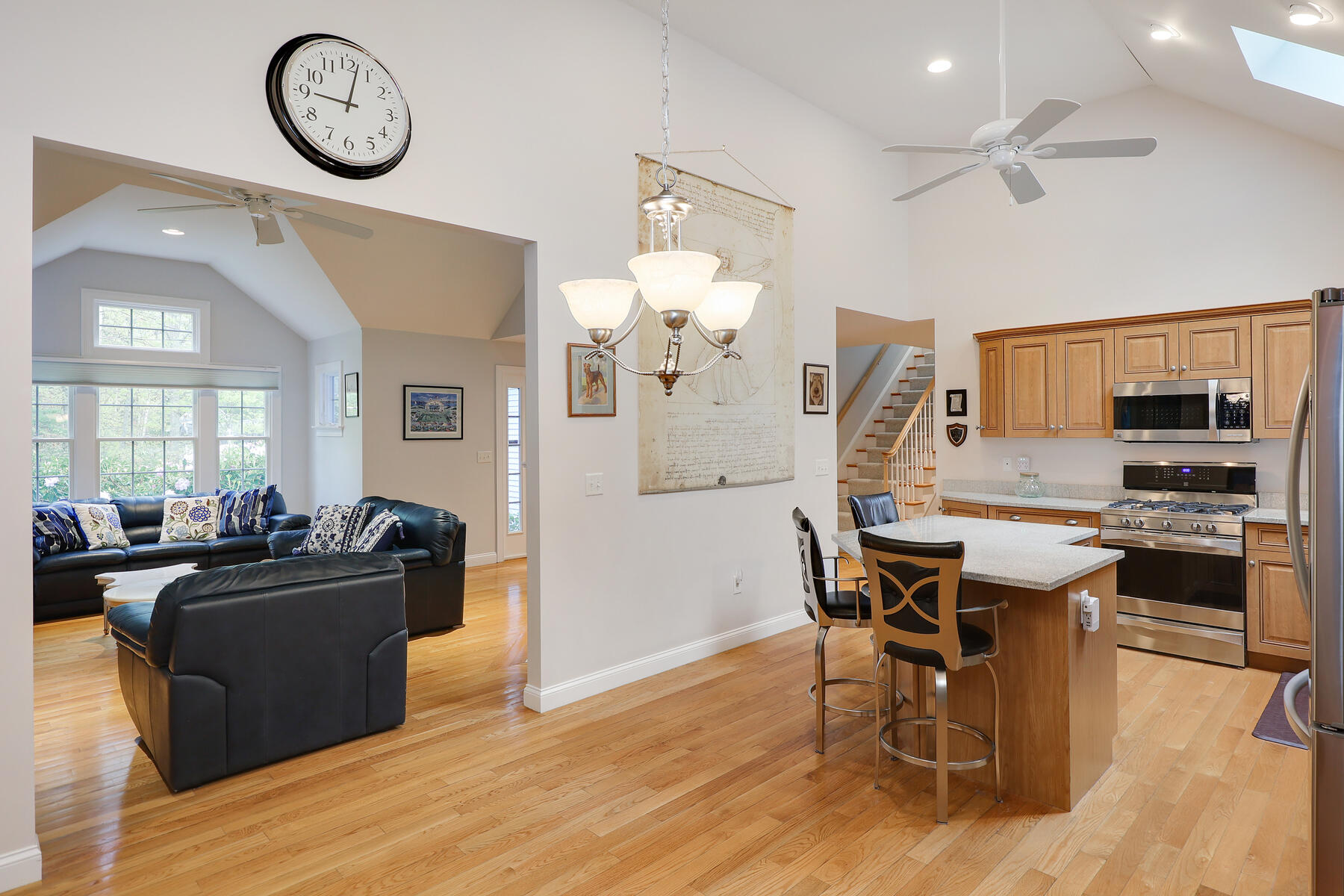 24 Sea Robin Road Osterville, MA 02655 - Photo 6 of 45 a view of a dining room with furniture a kitchen and chandelier