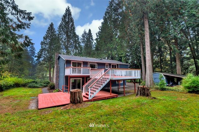 a view of a deck with a table and chairs