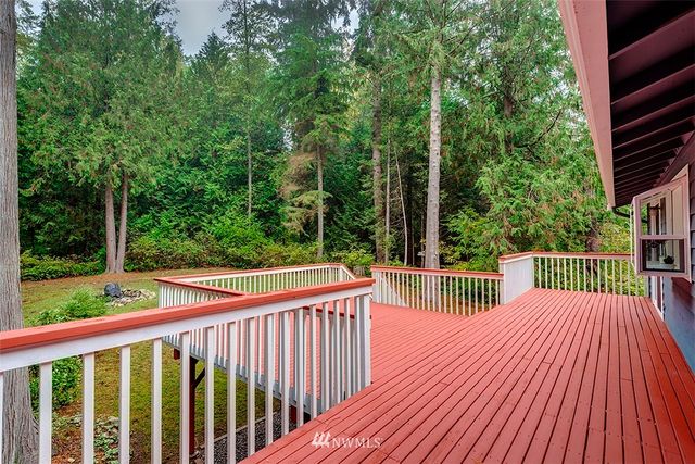 a view of balcony with deck and trees