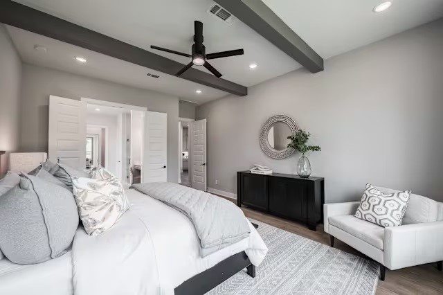 7810 Fulshear Rdg Drive Fulshear, TX 77441 - Photo 15 of 23 a bedroom with bed and a chandelier