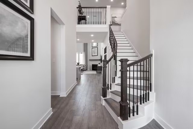 7810 Fulshear Rdg Drive Fulshear, TX 77441 - Photo 2 of 23 a view of a hallway with wooden floor and staircase