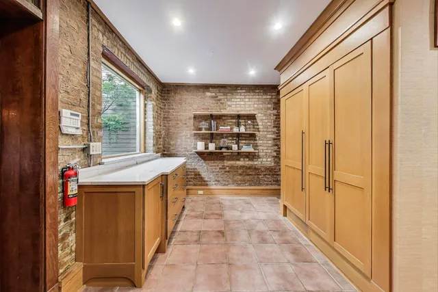 a view of a kitchen with a sink and dishwasher