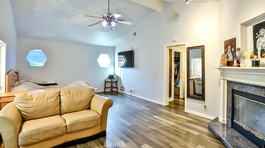4862 Gainsport Circle Irvine, CA 92604 - Photo 17 of 24 a living room with furniture a flat screen tv and a fireplace