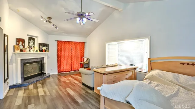 a bedroom with furniture and a fireplace