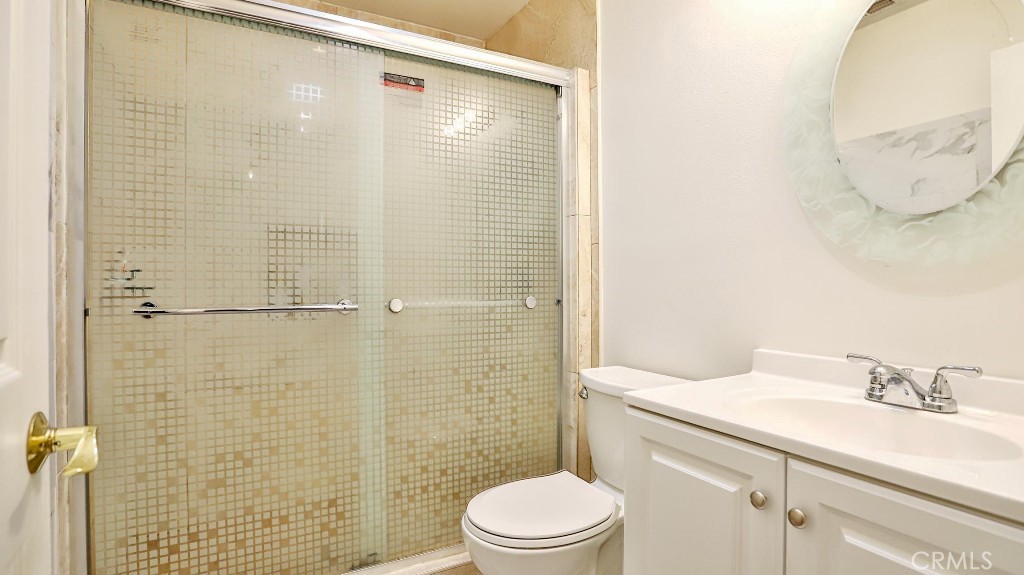 4862 Gainsport Circle Irvine, CA 92604 - Photo 22 of 24 a bathroom with a sink a toilet and shower