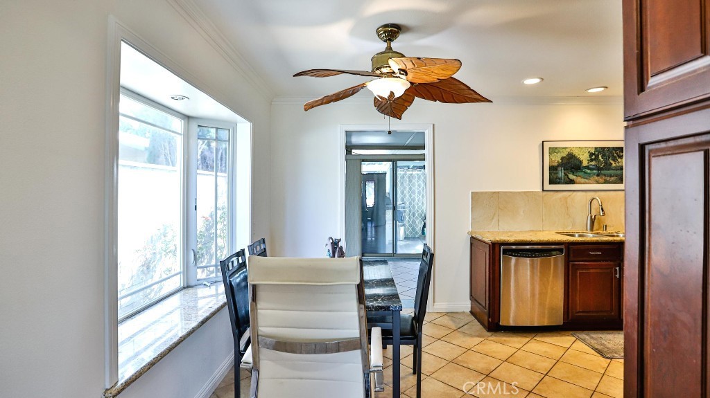 4862 Gainsport Circle Irvine, CA 92604 - Photo 5 of 24 a dining room filled chandelier and wooden floor