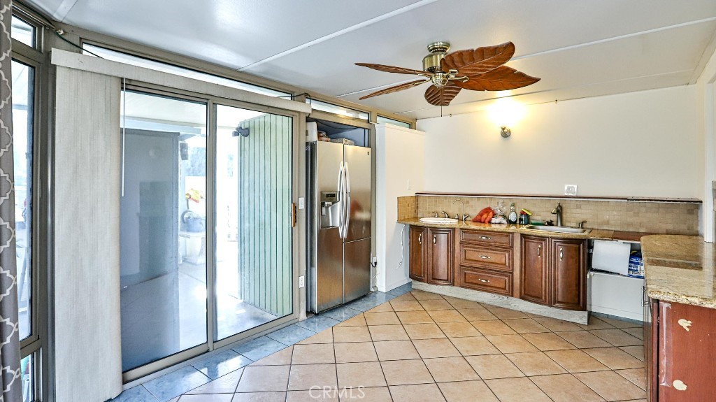 4862 Gainsport Circle Irvine, CA 92604 - Photo 8 of 24 a kitchen with stainless steel appliances granite countertop a refrigerator and a sink
