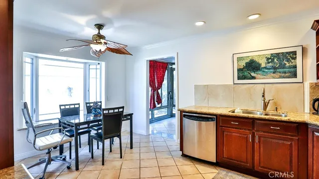 a view of a dining room with furniture wooden floor and chandelier