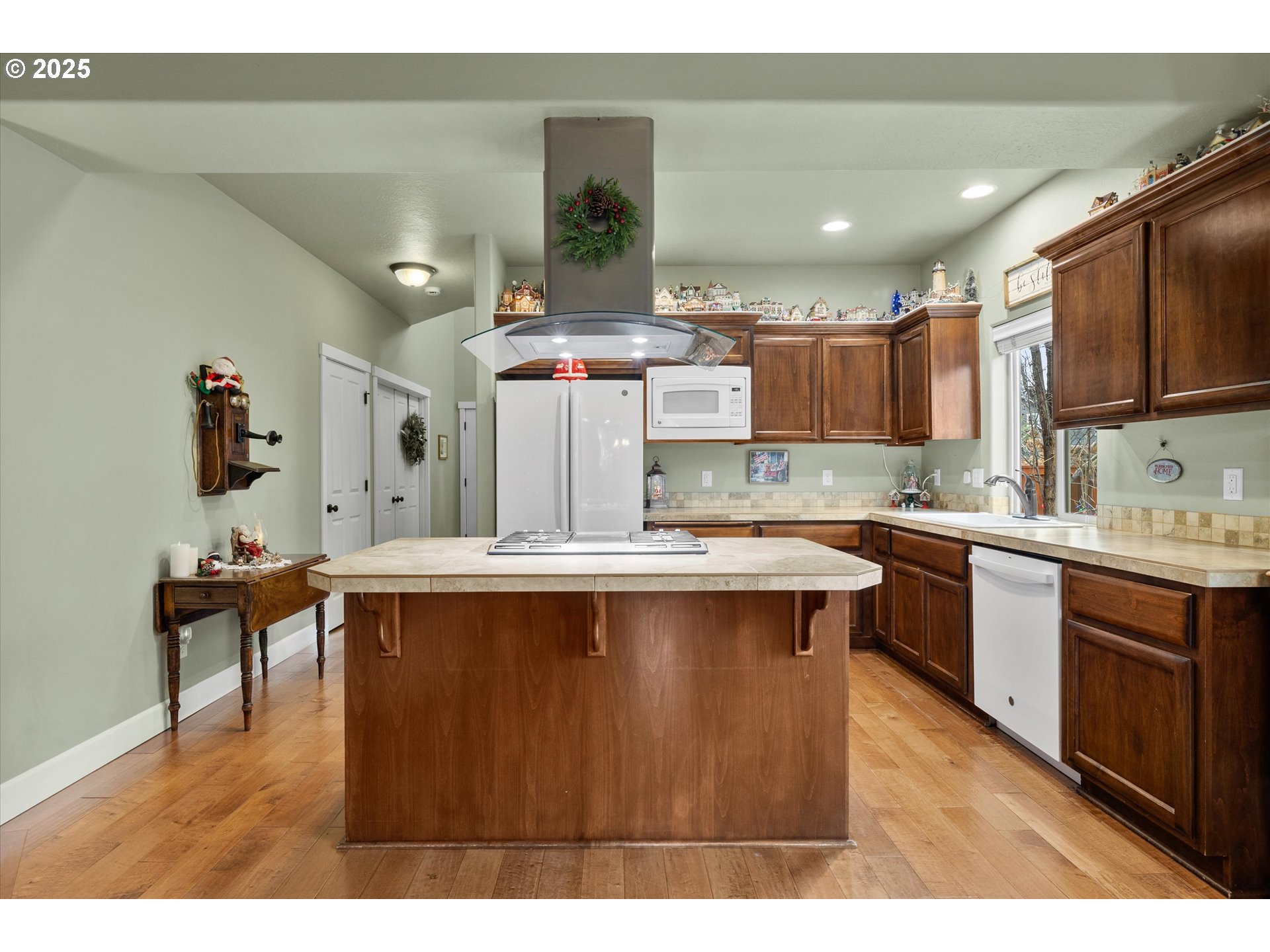 21281 Bellflower Place Bend, OR 97702 - Photo 12 of 48 a kitchen with kitchen island a sink counter top space and appliances