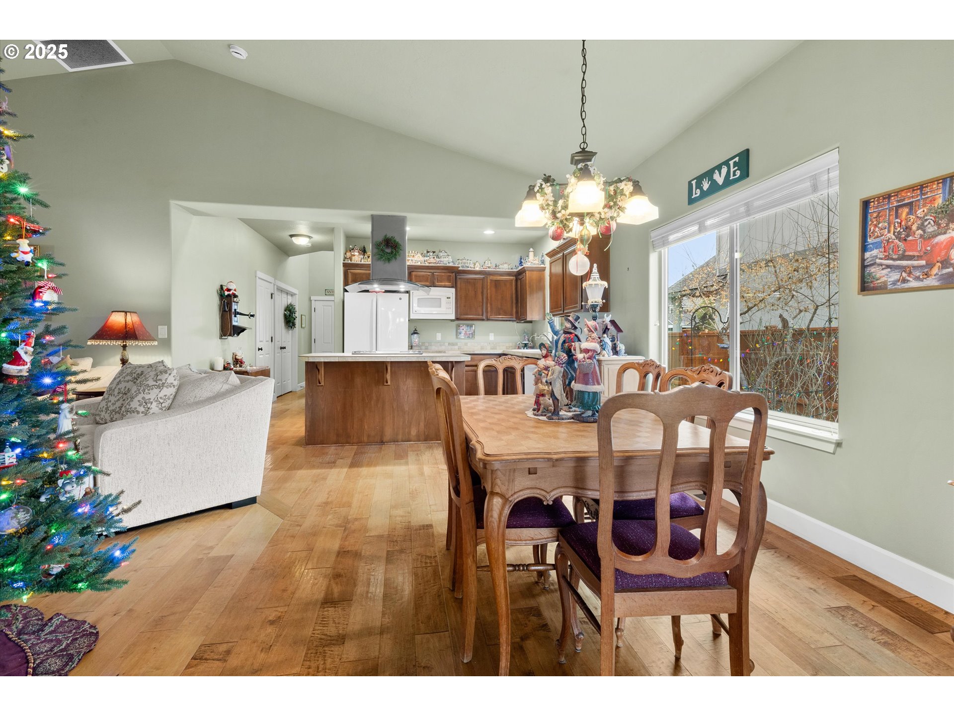 21281 Bellflower Place Bend, OR 97702 - Photo 13 of 48 a dining room view with furniture and chandelier