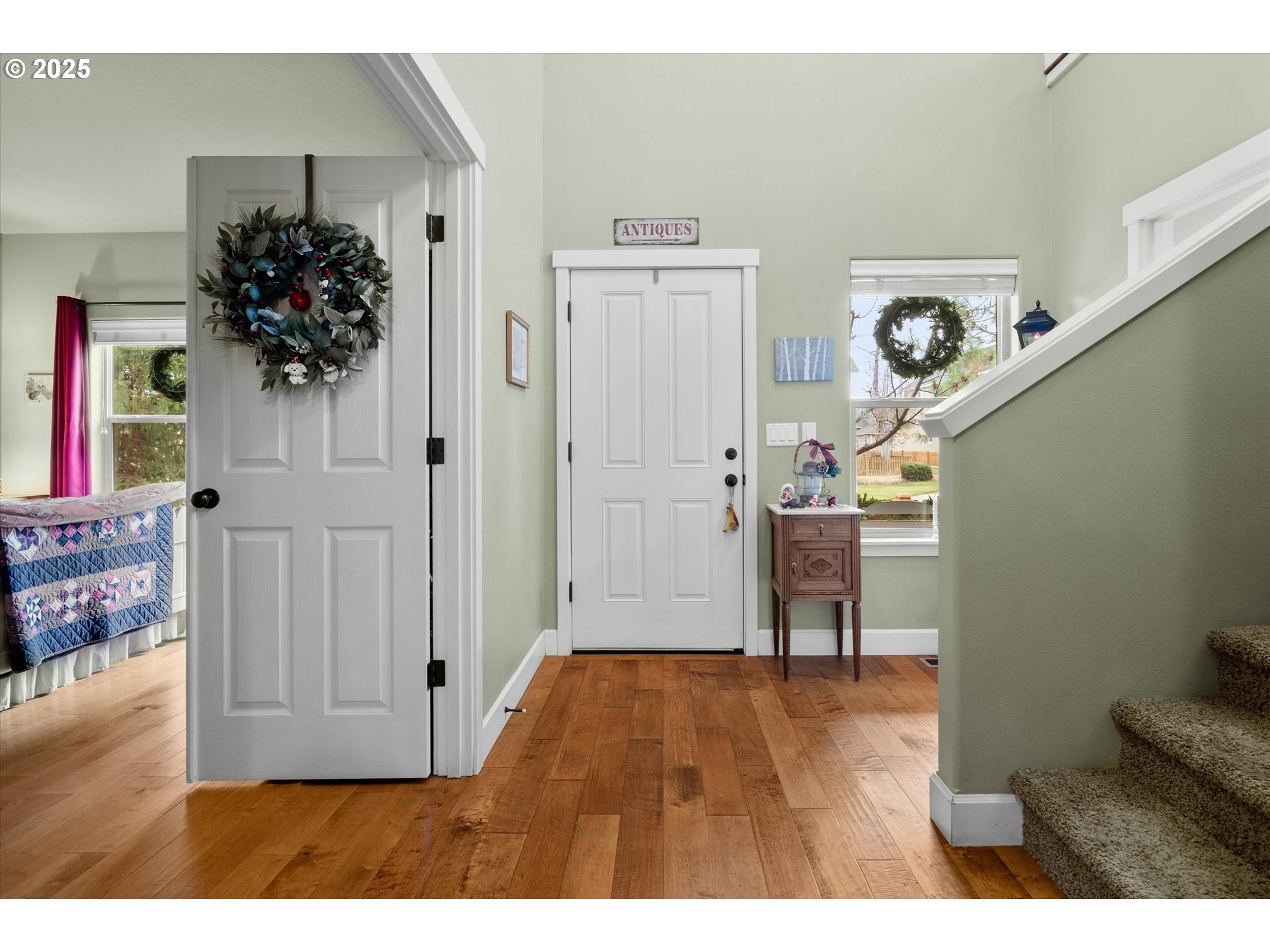 21281 Bellflower Place Bend, OR 97702 - Photo 14 of 48 a view of a hallway with wooden floor and a living room