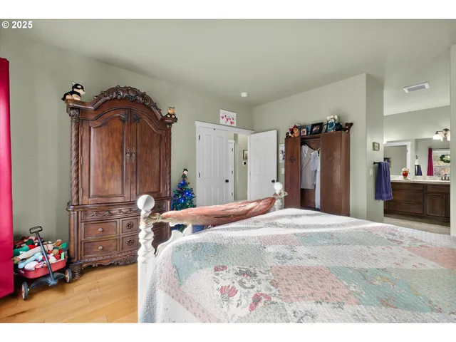 a spacious bathroom with a granite countertop double vanity sink mirror and