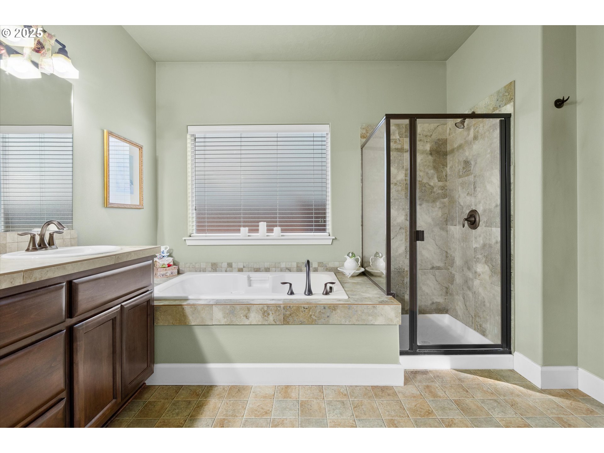 21281 Bellflower Place Bend, OR 97702 - Photo 18 of 48 a bathroom with a tub sink shower and mirror