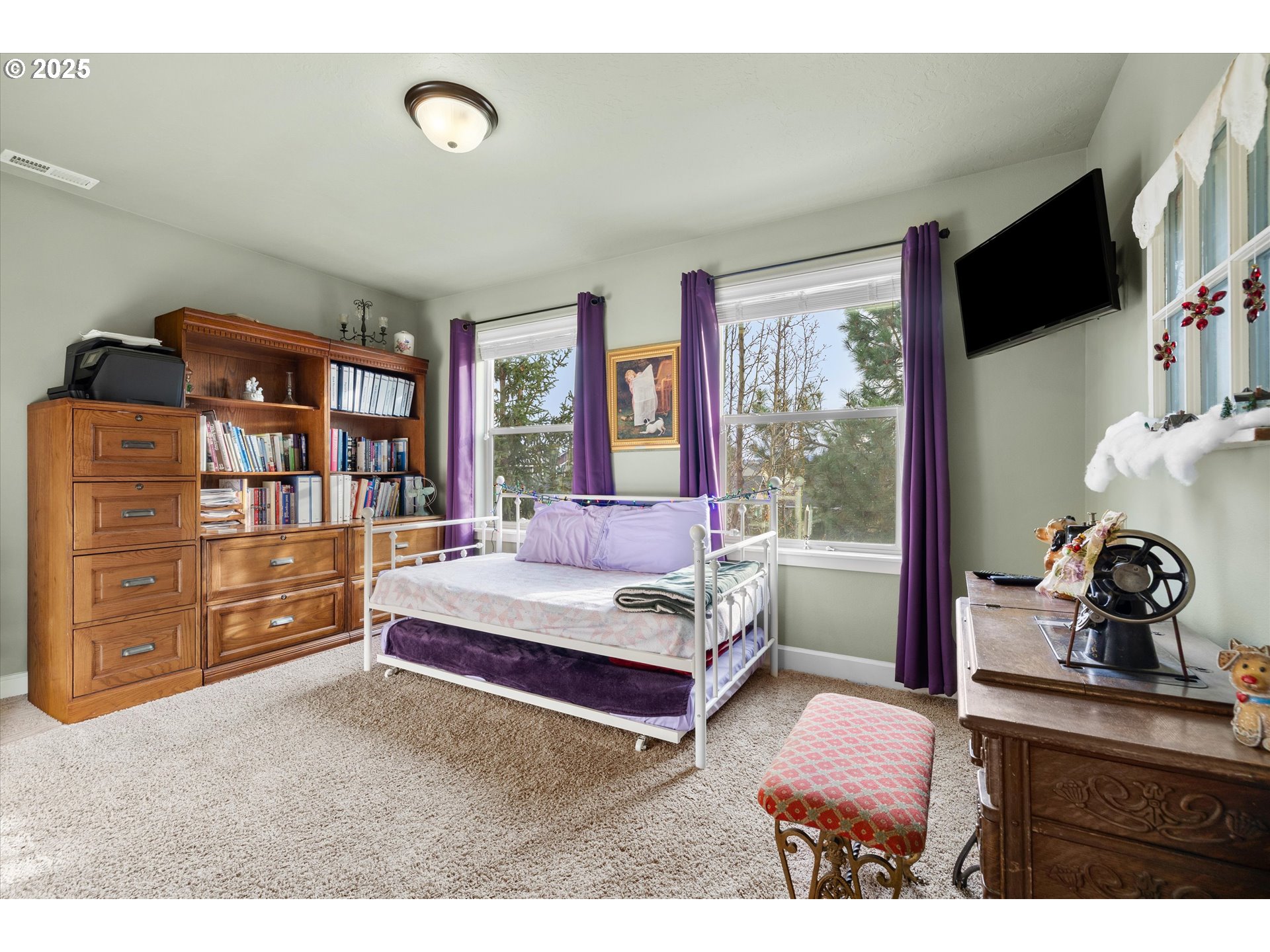 21281 Bellflower Place Bend, OR 97702 - Photo 24 of 48 a bedroom with a bed and large windows