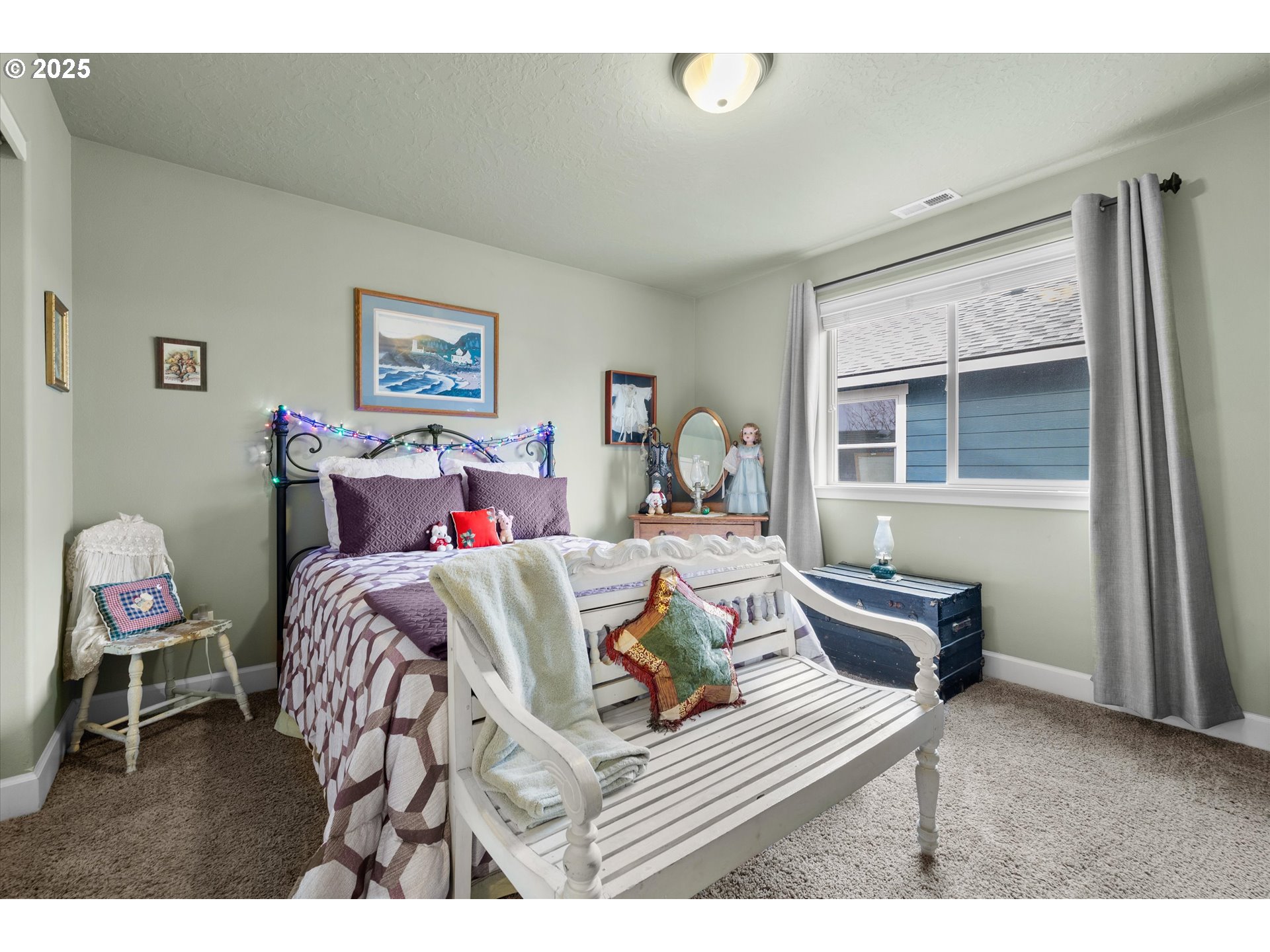 21281 Bellflower Place Bend, OR 97702 - Photo 26 of 48 a bedroom with a bed and wooden floor
