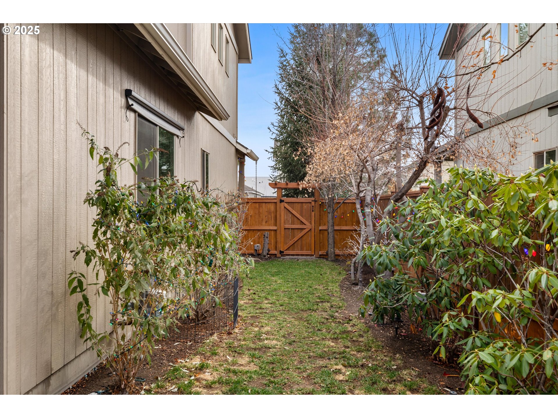 21281 Bellflower Place Bend, OR 97702 - Photo 32 of 48 a backyard of a house with lots of green space