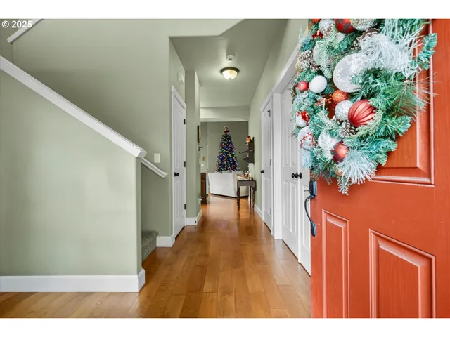 a living room with furniture a flat screen tv and a potted plant