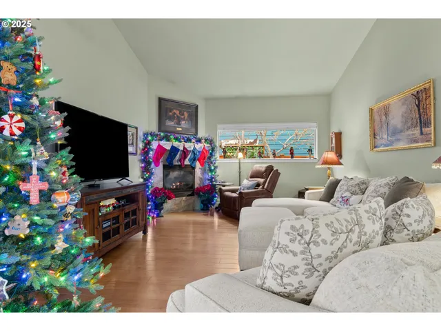 a living room with furniture and flowers