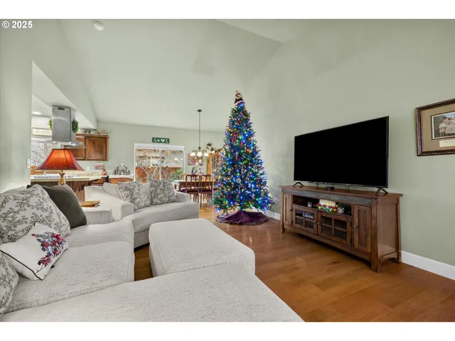 a living room with furniture and a christmas tree