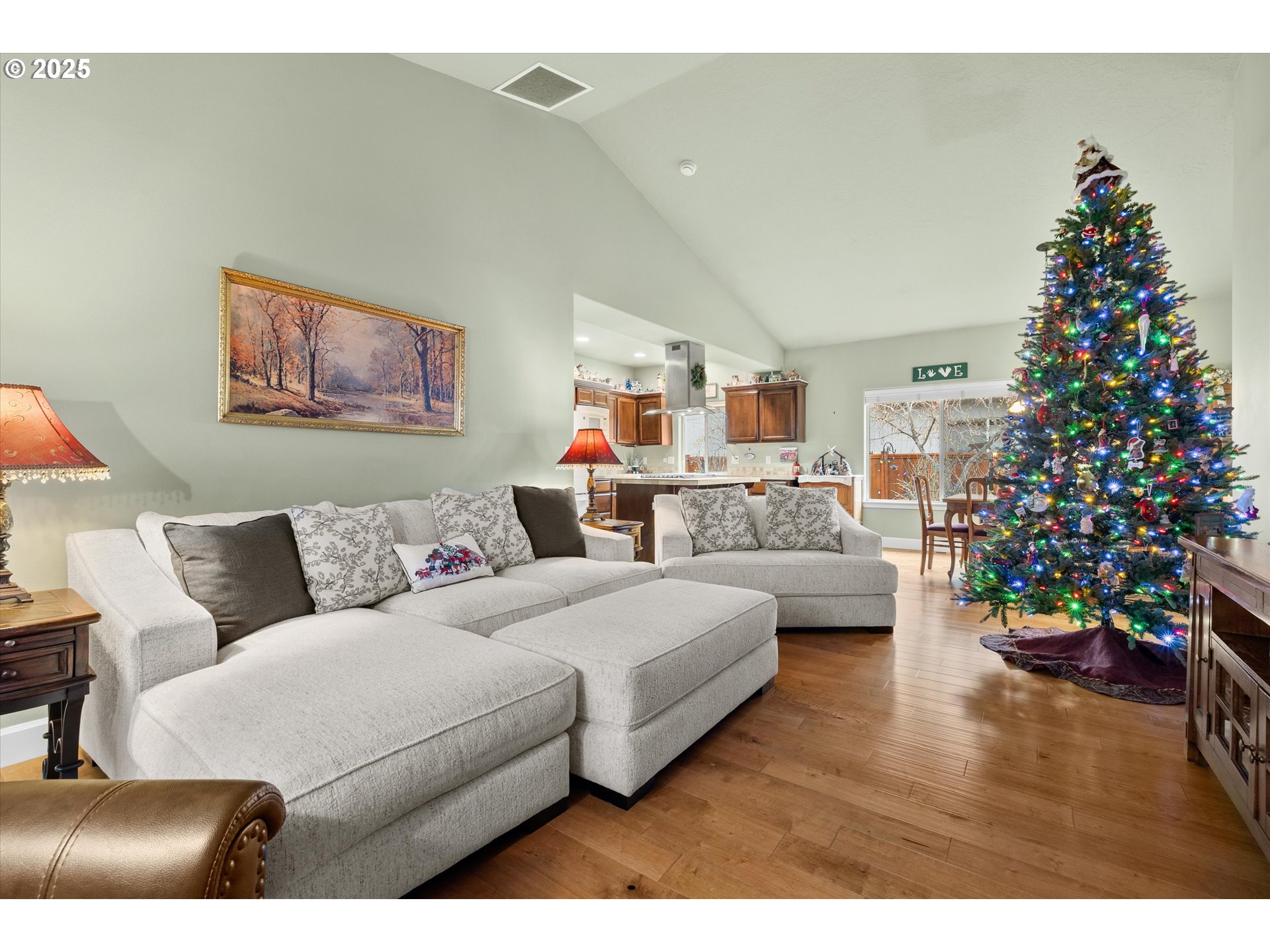 21281 Bellflower Place Bend, OR 97702 - Photo 8 of 48 a living room with furniture and a christmas tree