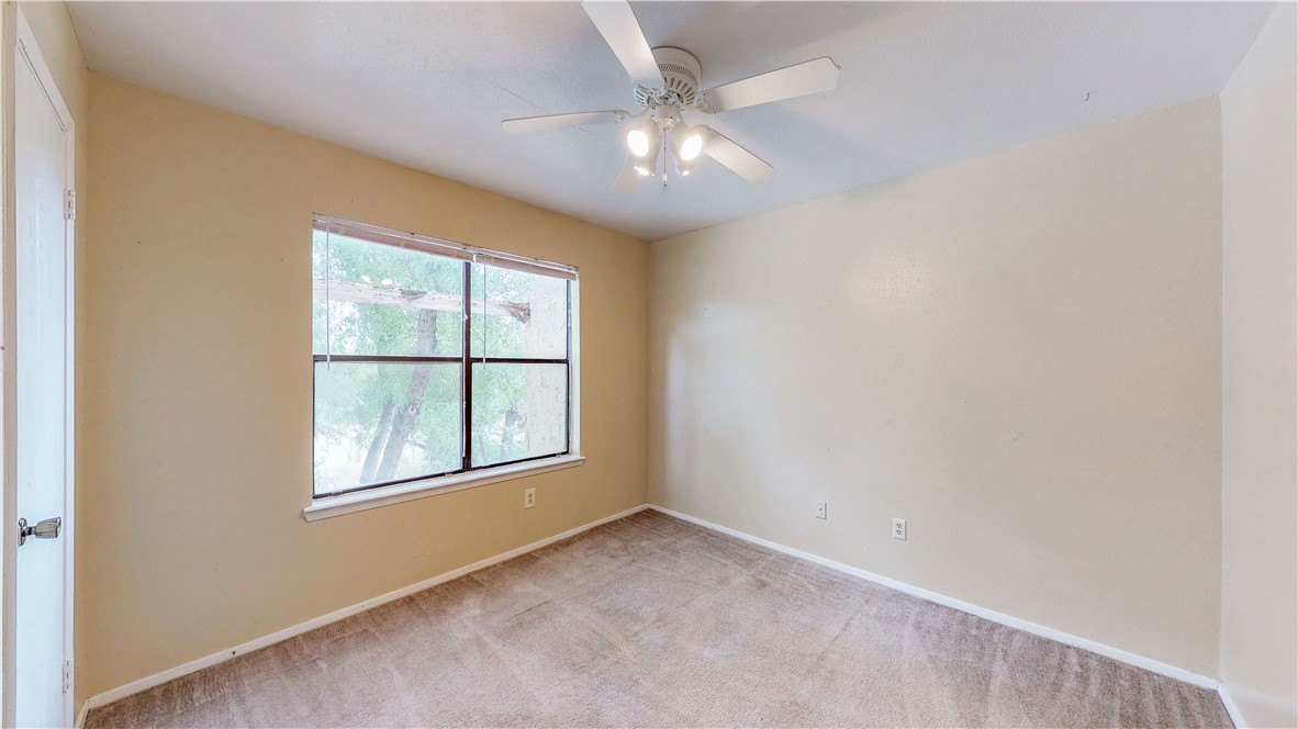 301 Manuel Drive, Unit C College Station, TX 77840 - Photo 17 of 25 an empty room with a window
