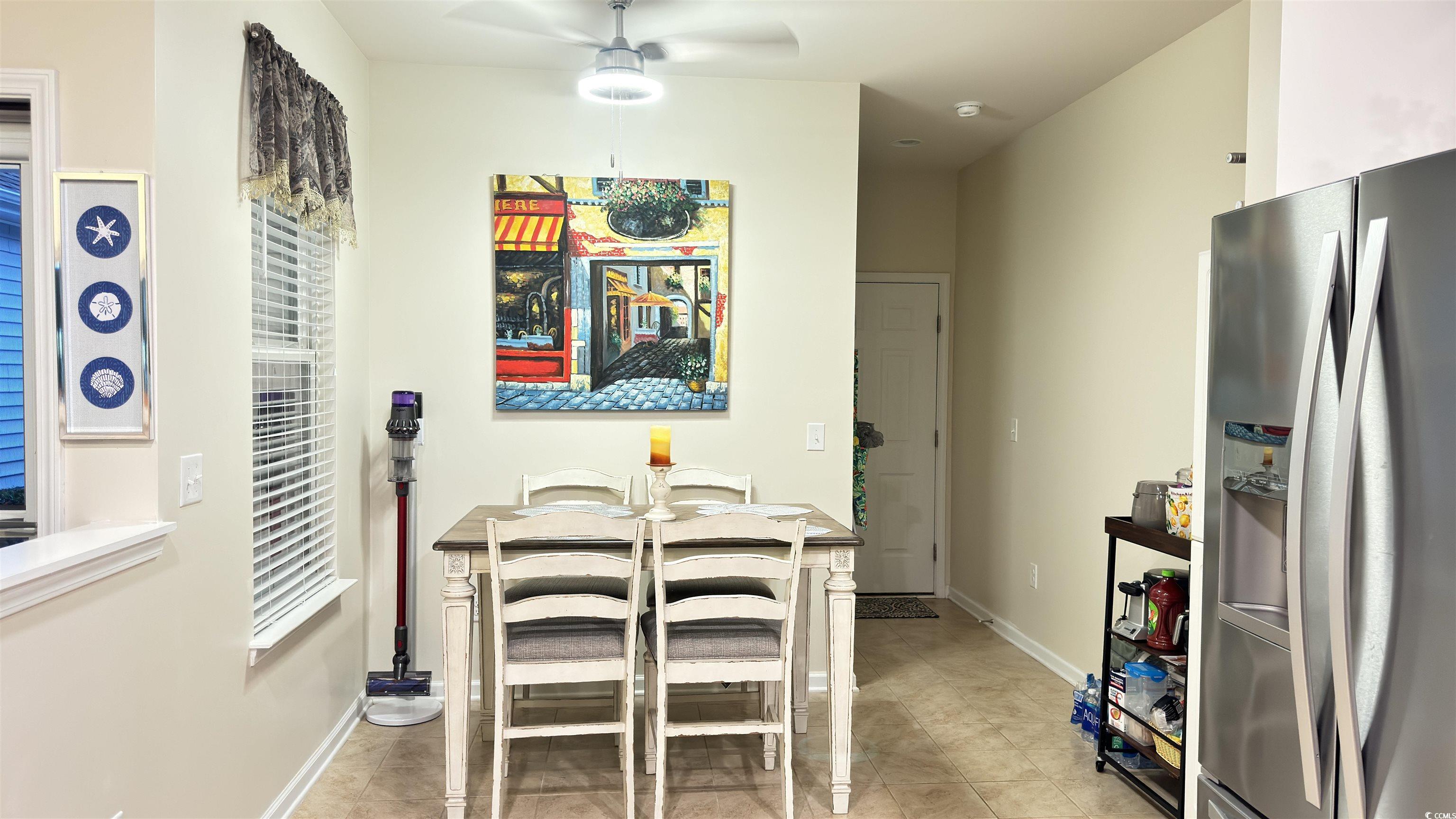 2122 Rayson Drive, Unit C Myrtle Beach, SC 29588 - Photo 8 of 20 Tiled dining room with ceiling fan