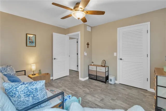 a bathroom with a sink a toilet a mirror and shower