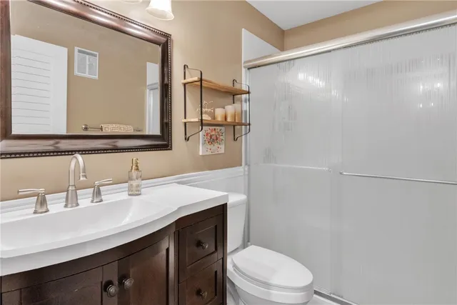 a view of a lake with a house in the background