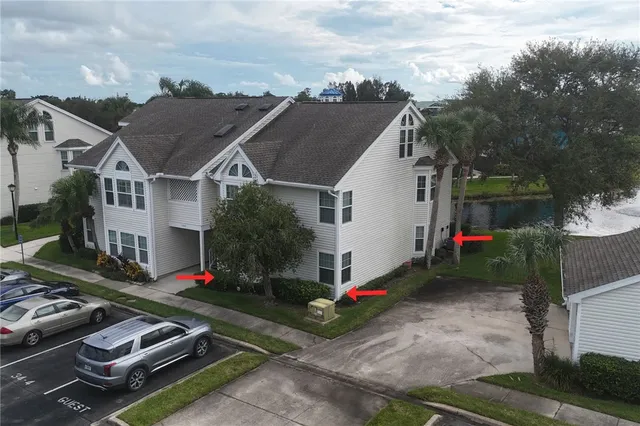 a living room with furniture a wooden floor and chandelier