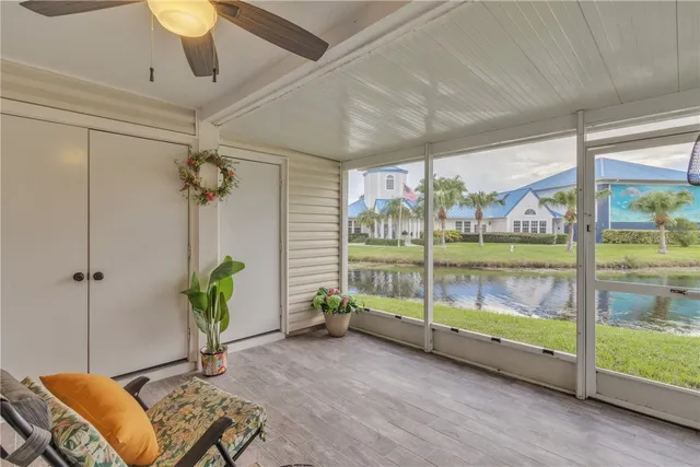 a living room filled with furniture and a chandelier