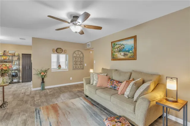 a view of a dining room with a table and chairs