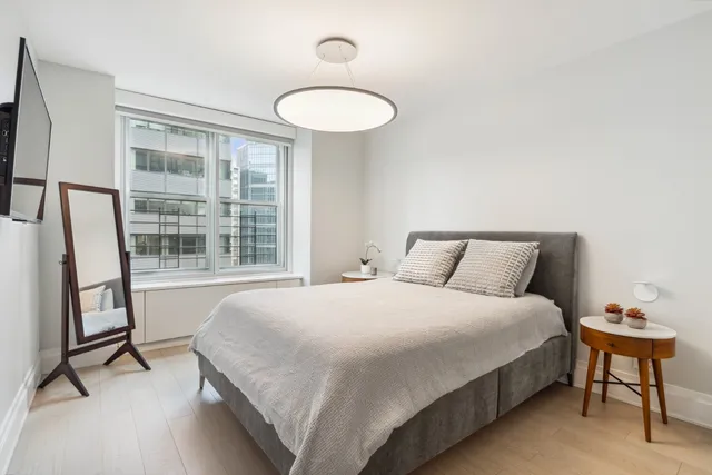a kitchen with stainless steel appliances kitchen island granite countertop a sink and cabinets