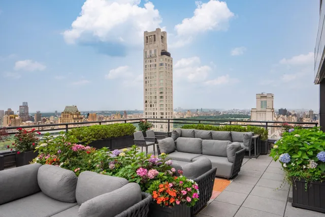 a bathroom with a toilet sink a shower and a mirror
