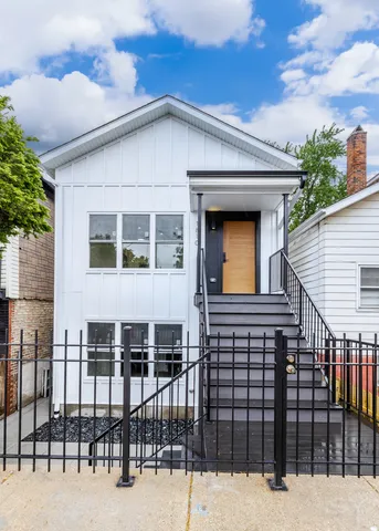 a front view of a house with glass windows