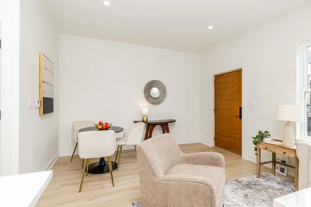 a living room with furniture and a table
