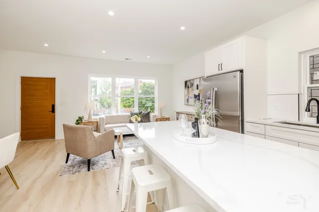 a dining room with furniture and wooden floor