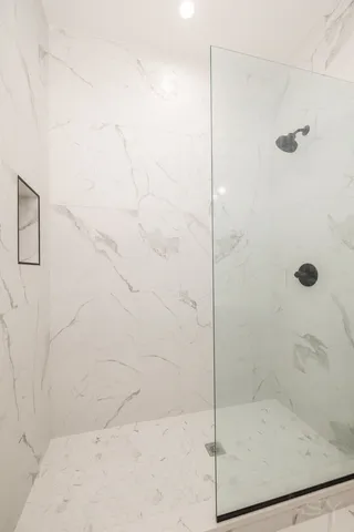 a bathroom with a sink a toilet and mirror